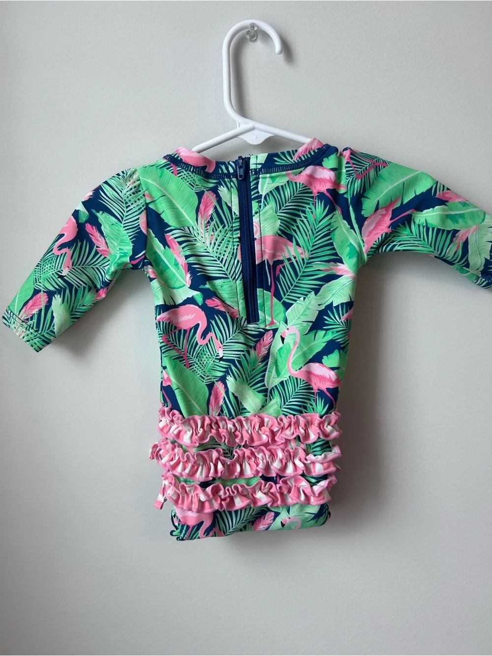 Ruffle Butts Navy One-Piece Swim with Pink Flamingo & Green Leaves